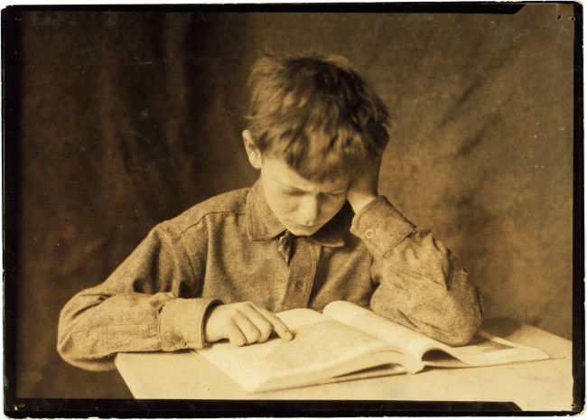 Lewis_Hine%2C_Boy_studying%2C_ca._1924-1