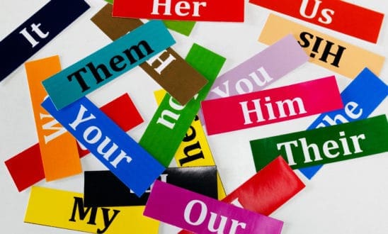 Bright colored paper with pronouns like your, my, her, him, their.
