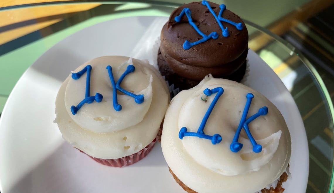 Three cupcakes with 1K piped in blue icing
