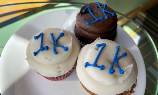 Three cupcakes with 1K piped in blue icing